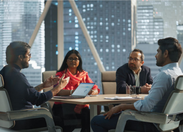 employees working at conference room table